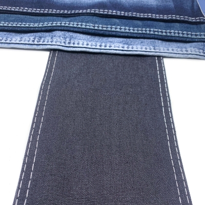 GX-AF B6024 Width: 178-180cm Weight: 9.6OZ Shrinkage: Warp:6-7% Weft:13-15% Weave: Right-hand twill Composition: 64.0% Cotton, 31.5% Tencel , 3.6% Rayon, 0.9% Spandex 10 count Slub yarn Super Sirospun TR dual core Medium stretch side view